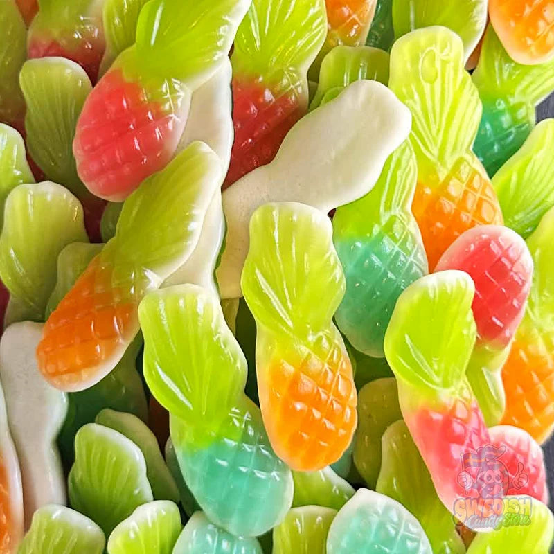 Colorful gummy candies shaped like big pineapples.